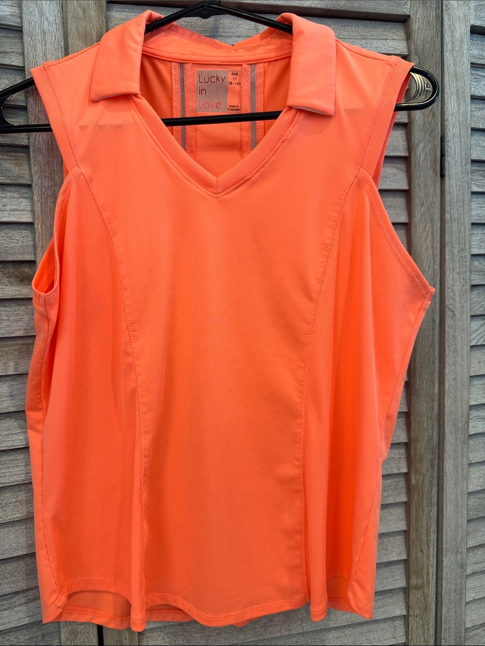 Lucky in Love Sleeveless V-Neck Polo Tank in Coral